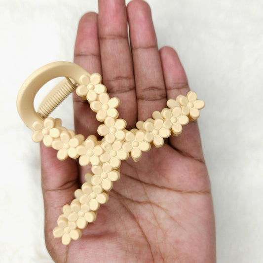 Hand holding a beige against a white background