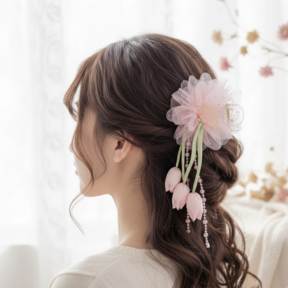 Woman with floral hair accessory in a softly blurred indoor setting