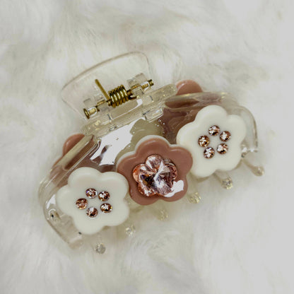 Clear hair clip with floral designs on a white background