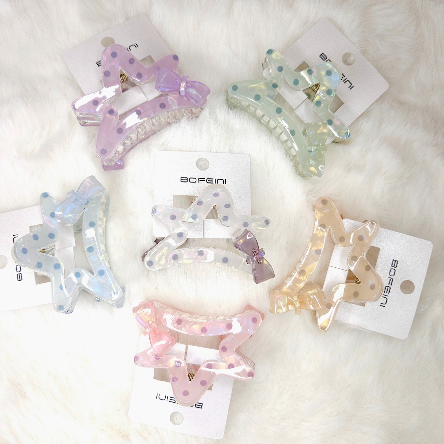 Set of colorful hair clips on white background