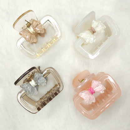 Set of decorative hair clips with bows on a white background