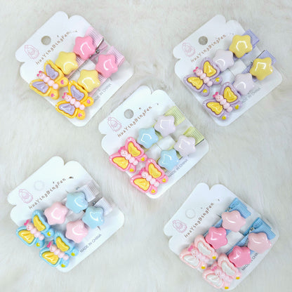 Set of five packages containing colorful butterfly and heart-shaped hair clips on a light gray background.