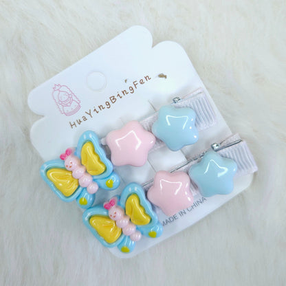 Packaged children's hair accessories with butterfly designs on a white background