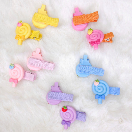 Colorful hair clips on a white fluffy background