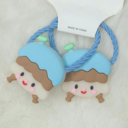 Two cute character-themed hair ties with a 'Made in China' tag on a light background