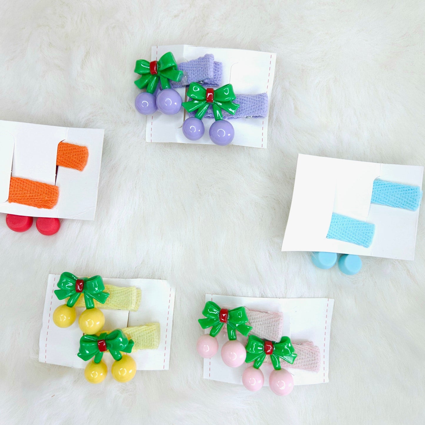 Colorful hair accessories with bows on a white background