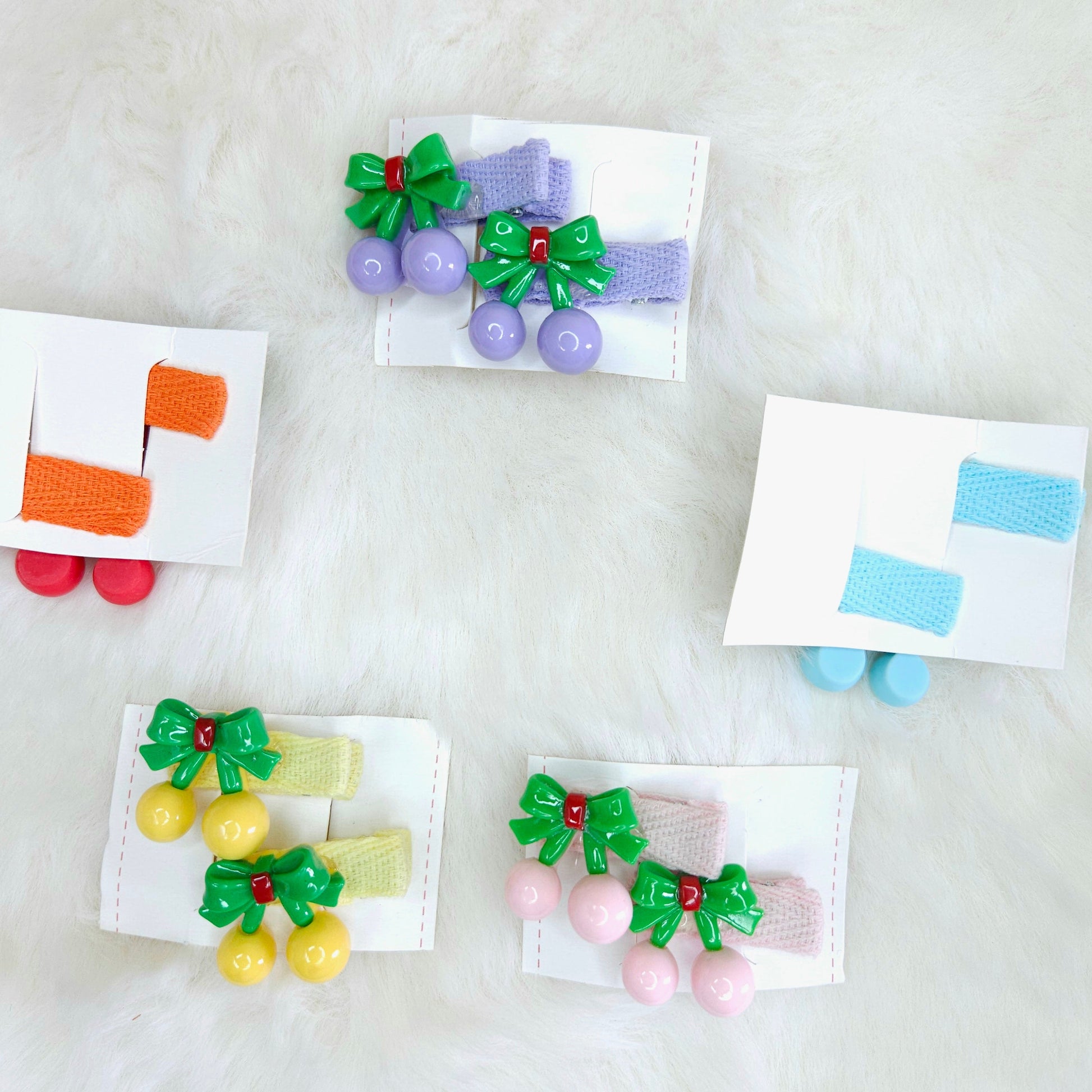 Colorful hair accessories with bows on a white background