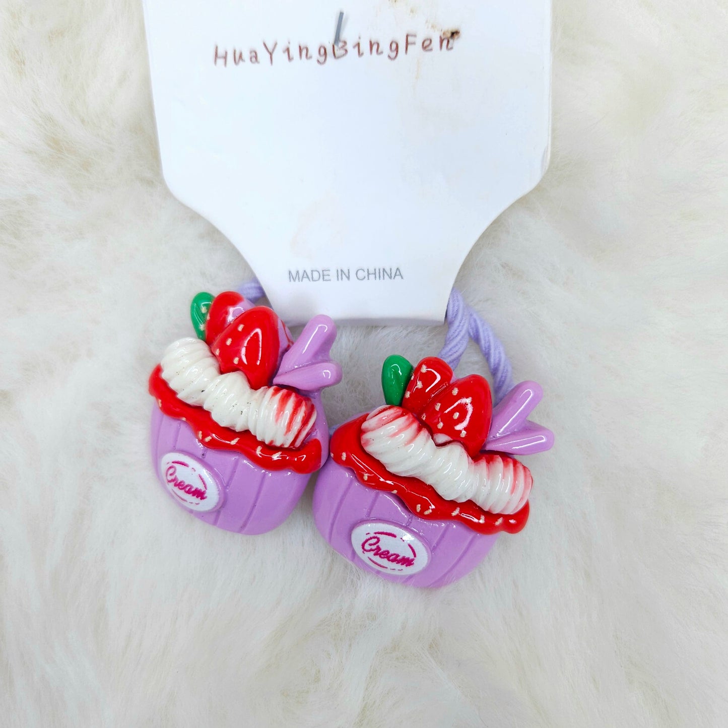 Colorful dessert-themed hair ties with 'Dream' branding on a white background
