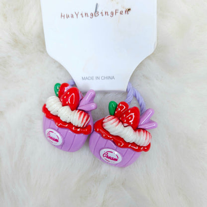 Colorful dessert-themed hair ties with 'Dream' branding on a white background