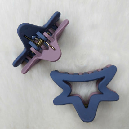Two purple hair clips on a white background