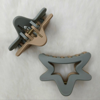 Two gray hair clips on a white background