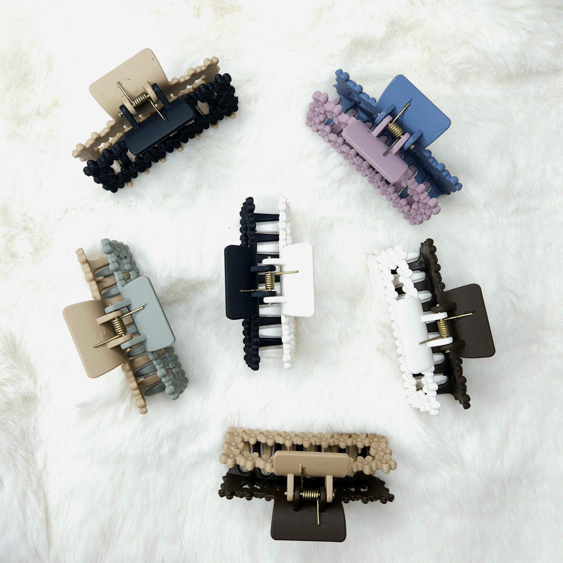 Set of hair clips on a white textured background