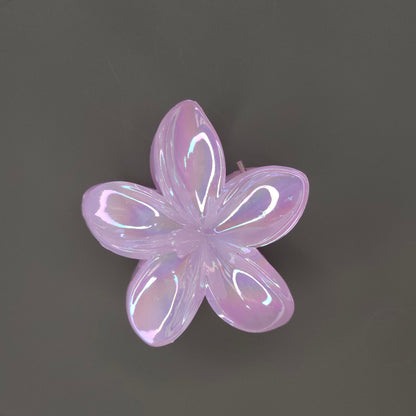 A single medium-sized, glossy pink flower hair claw clip with a shimmering, iridescent finish, designed with layered petals.