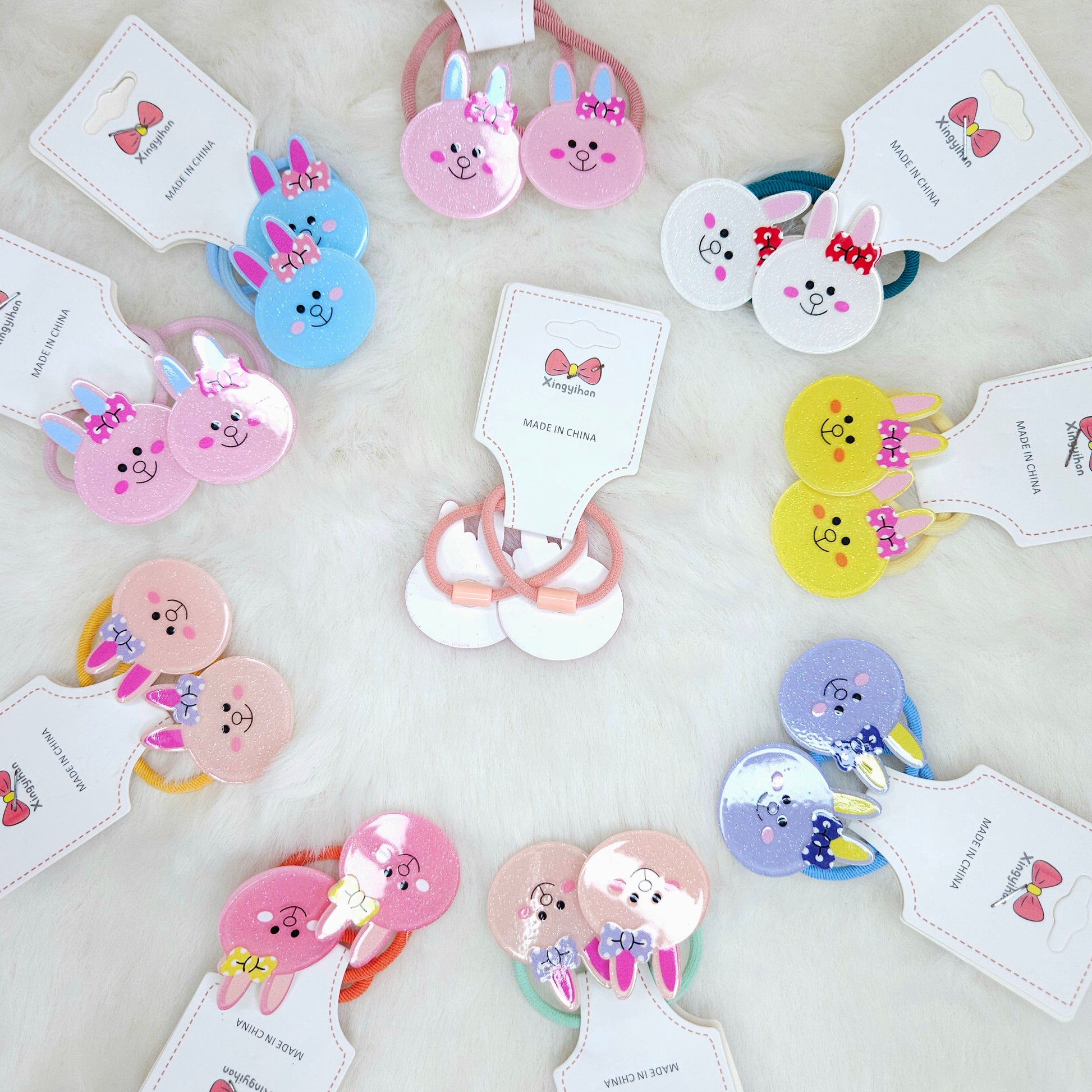 Colorful hair accessories with cartoon designs on a light background