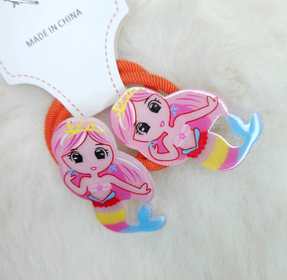 Two mermaid-themed hair ties on a white background with 'Made in China' label.