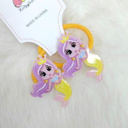 Mermaid-themed hair ties with a 'Made in China' label on a light background