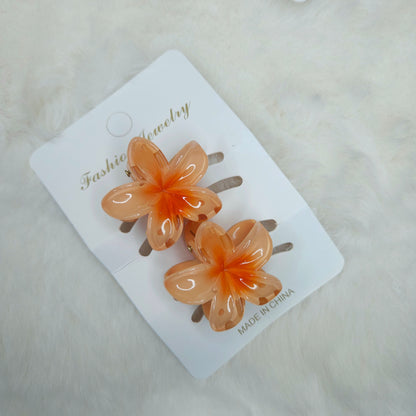 Flower-shaped hair clips on a white card with 'Fashion Jewelry' text.