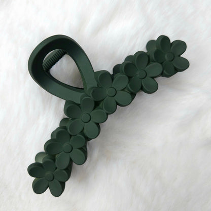 Dark green floral-patterned hair claw on a white background