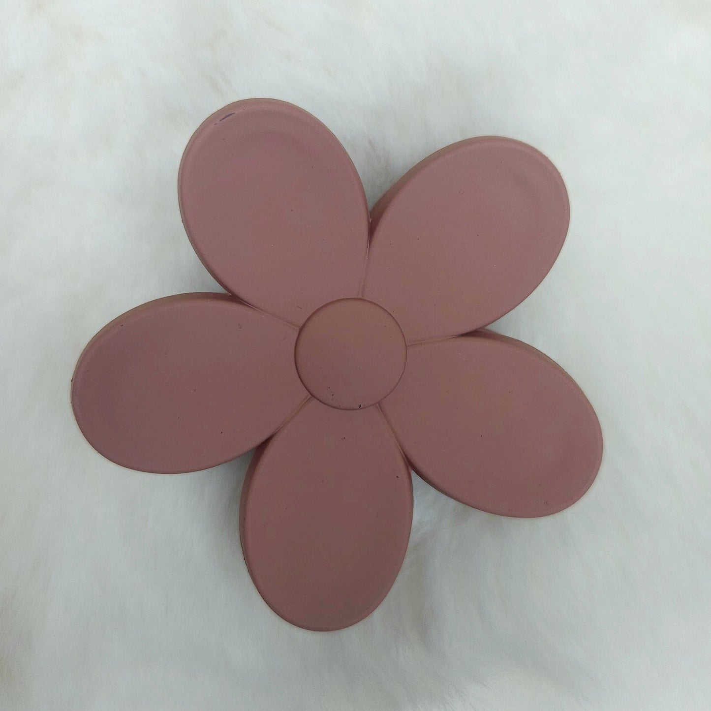 Brown flower-shaped hair claw on a white background