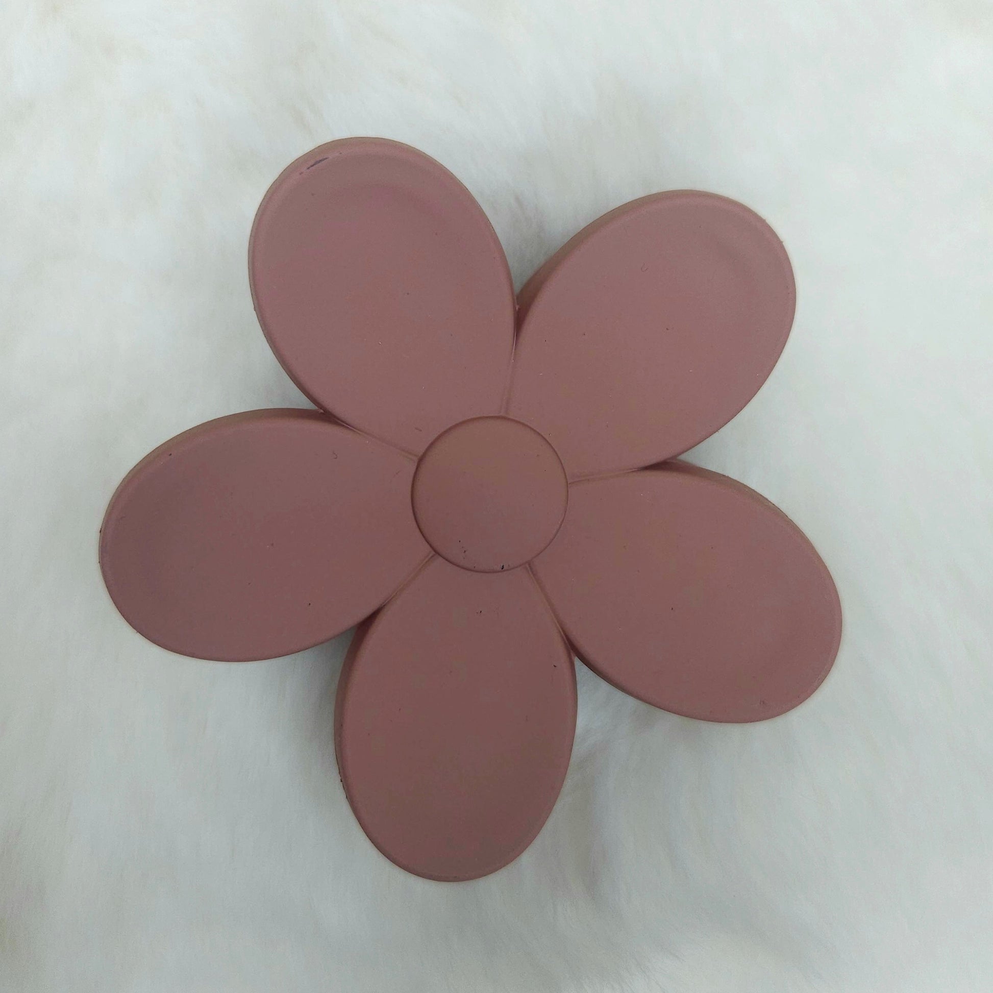 Brown flower-shaped hair claw on a white background