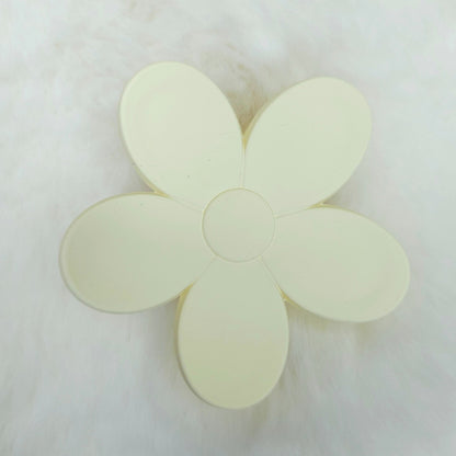 Flower-shaped hair claw clip on a white background
