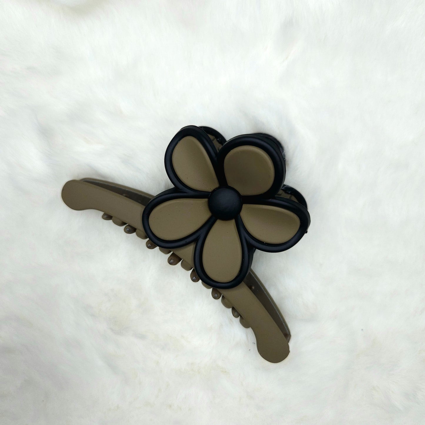 Green color Hair claw clip with flower design on a white background