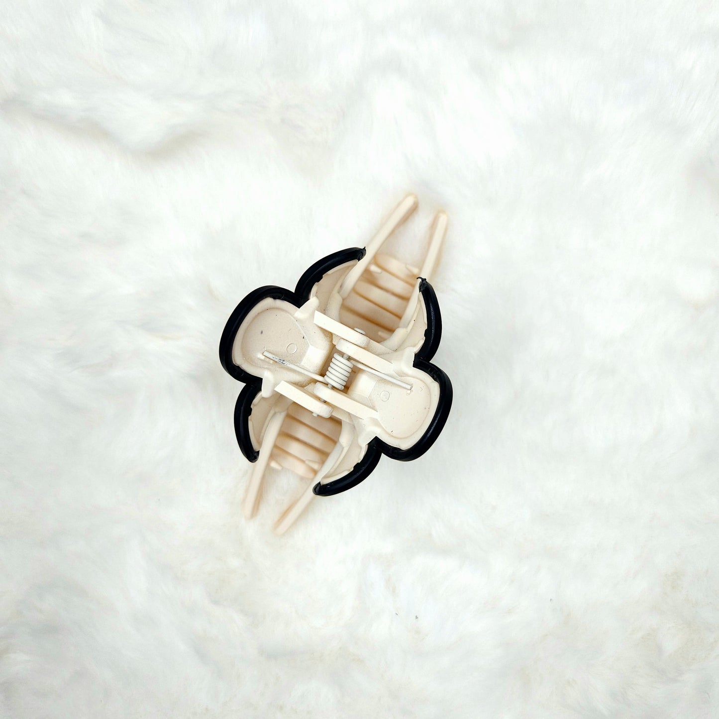 Hair claw clip from over head position  on a white background