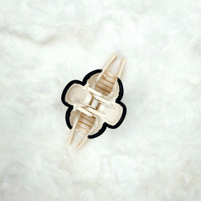 Hair claw clip from over head position  on a white background