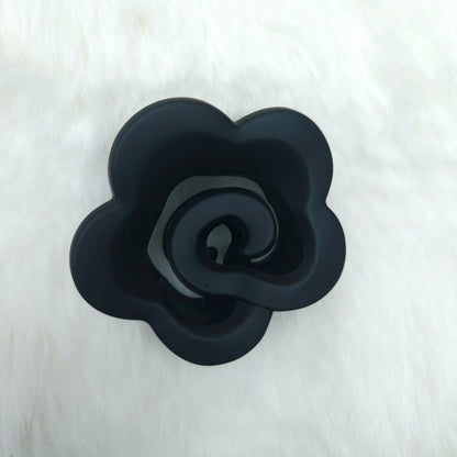 Black rose-shaped hair claw on a white background