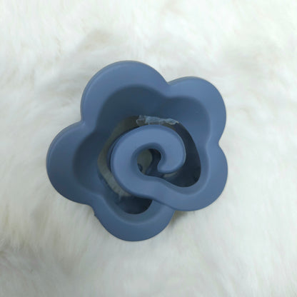 Blue flower-shaped hair claw on a white background