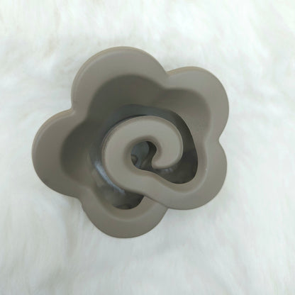 Gray flower-shaped hair claw on a white background