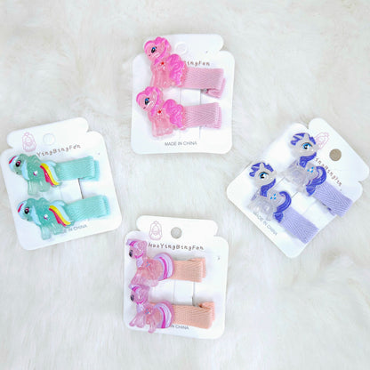 Set of colorful hair clips on their packaging with a white background