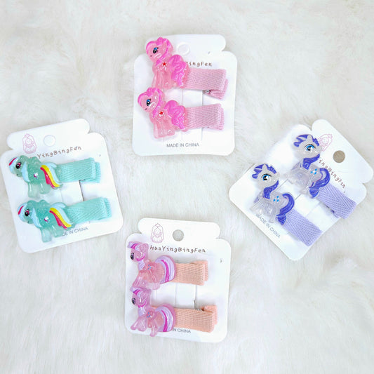 Set of colorful hair clips on their packaging with a white background