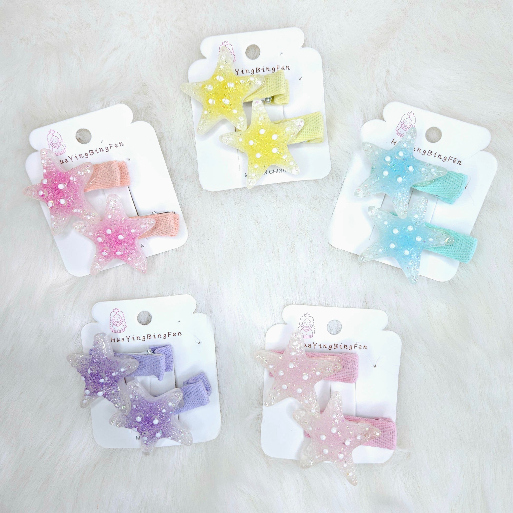Set of five star-shaped hair clips on cards with 'Nanying Dingshufen' branding against a light background.