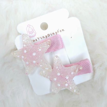 Pink and white hair clips on a card with 'WangYingBingFen' branding on a white fur background.