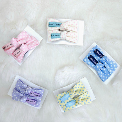 Set of colorful bow ties in packaging on a light background