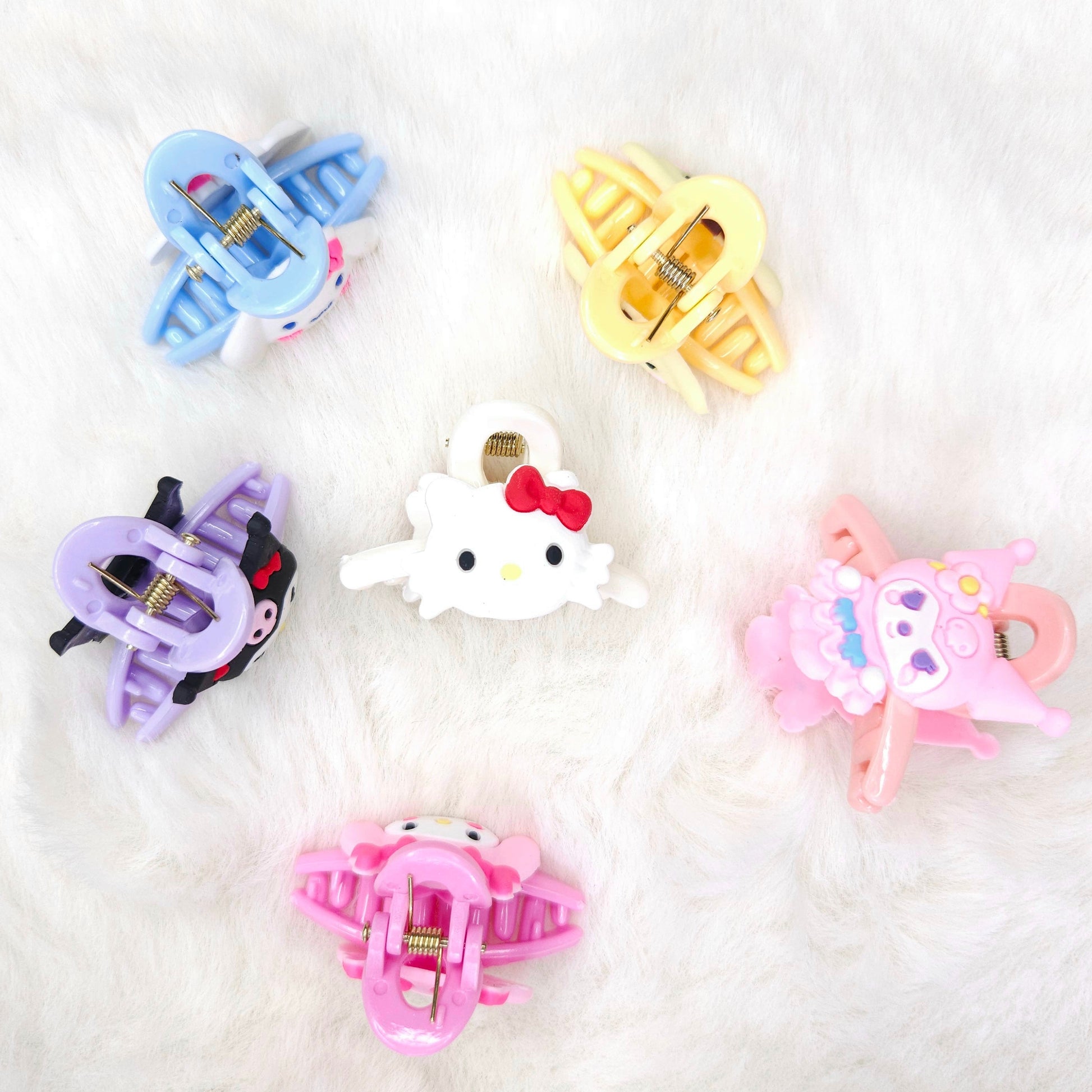 Set of colorful hair clips on a white background
