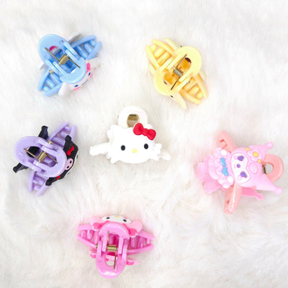 Set of colorful hair clips on a white background