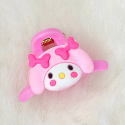 Pink cartoon character hair clip with a bow on a white background