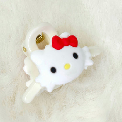 Hello Kitty-themed phone jack hair claw clip on a white background