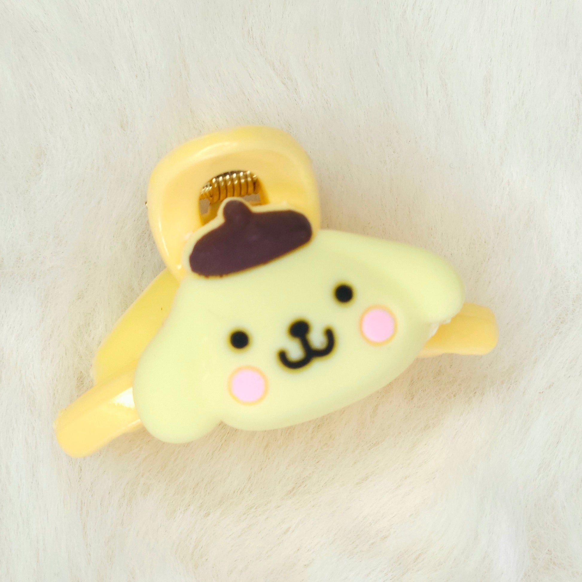 Cute plush hair claw clip with a brown hat on a white background