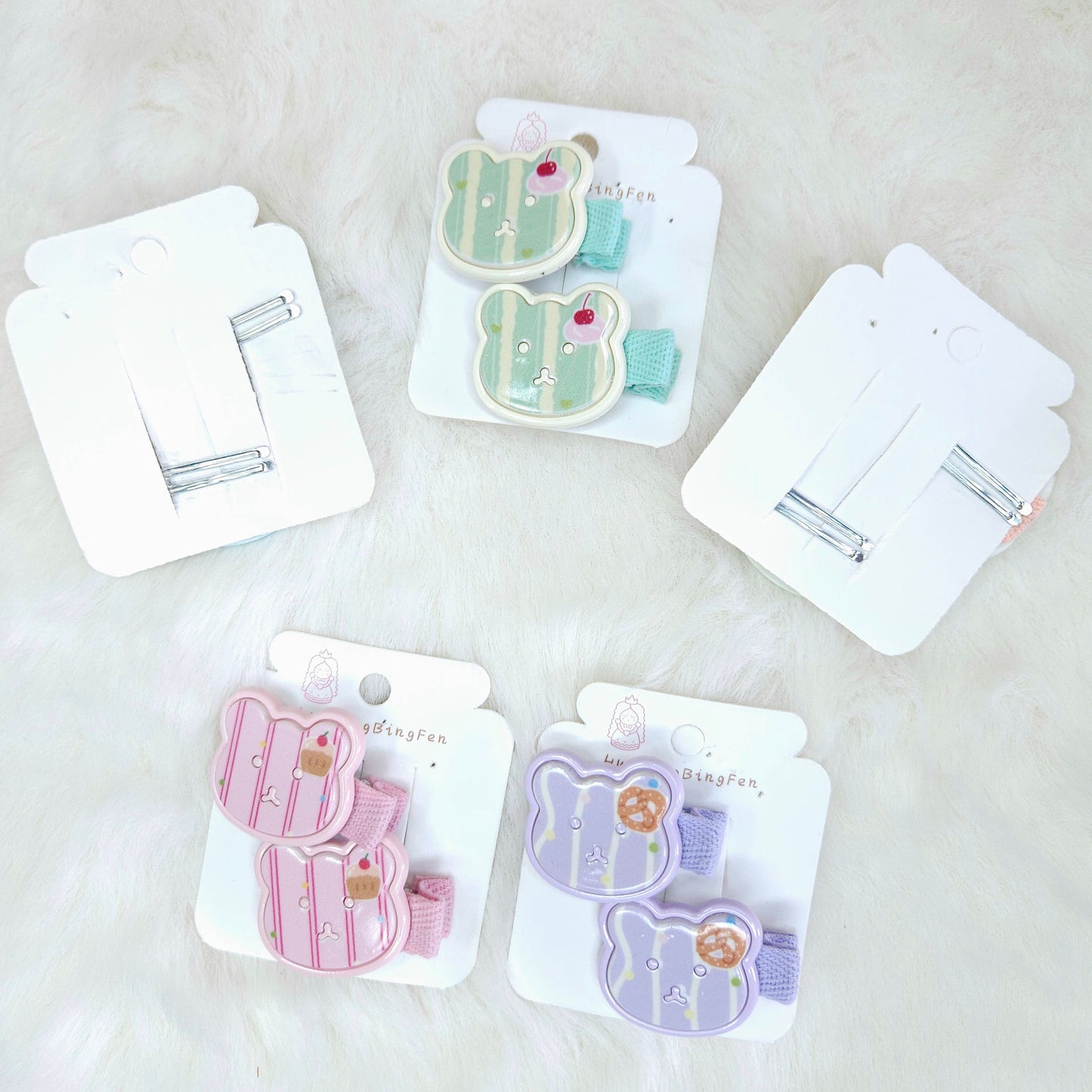 Set of hair clips in packaging on a light background