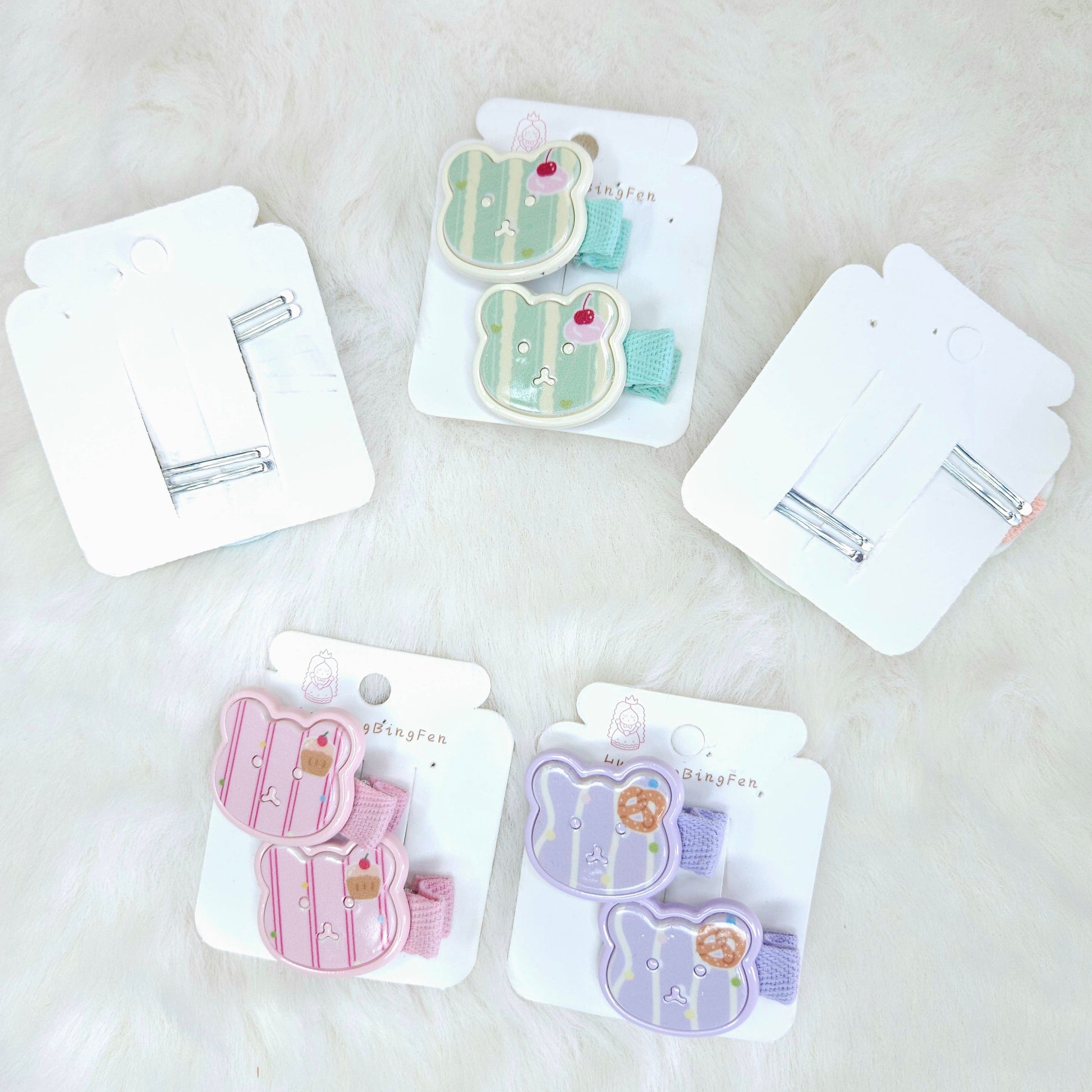 Set of hair clips in packaging on a light background