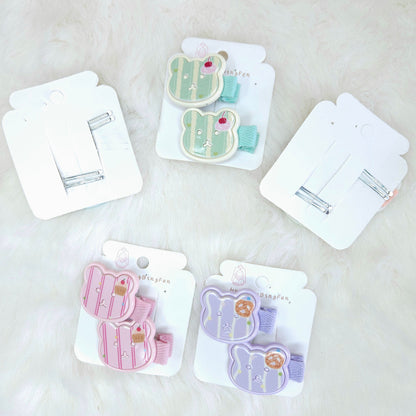 Set of hair clips in packaging on a light background