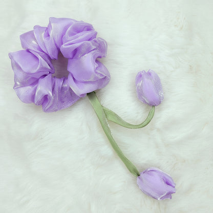 Soft lavender hair scrunchie styled with tulip-shaped fabric flowers on green stems.
