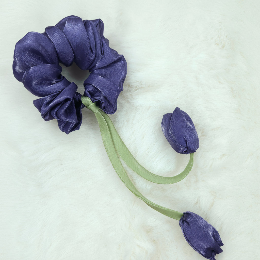 Lilac satin scrunchie with tulip flower embellishments and green ribbon ties.