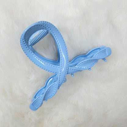 Light blue hair clip on a white background