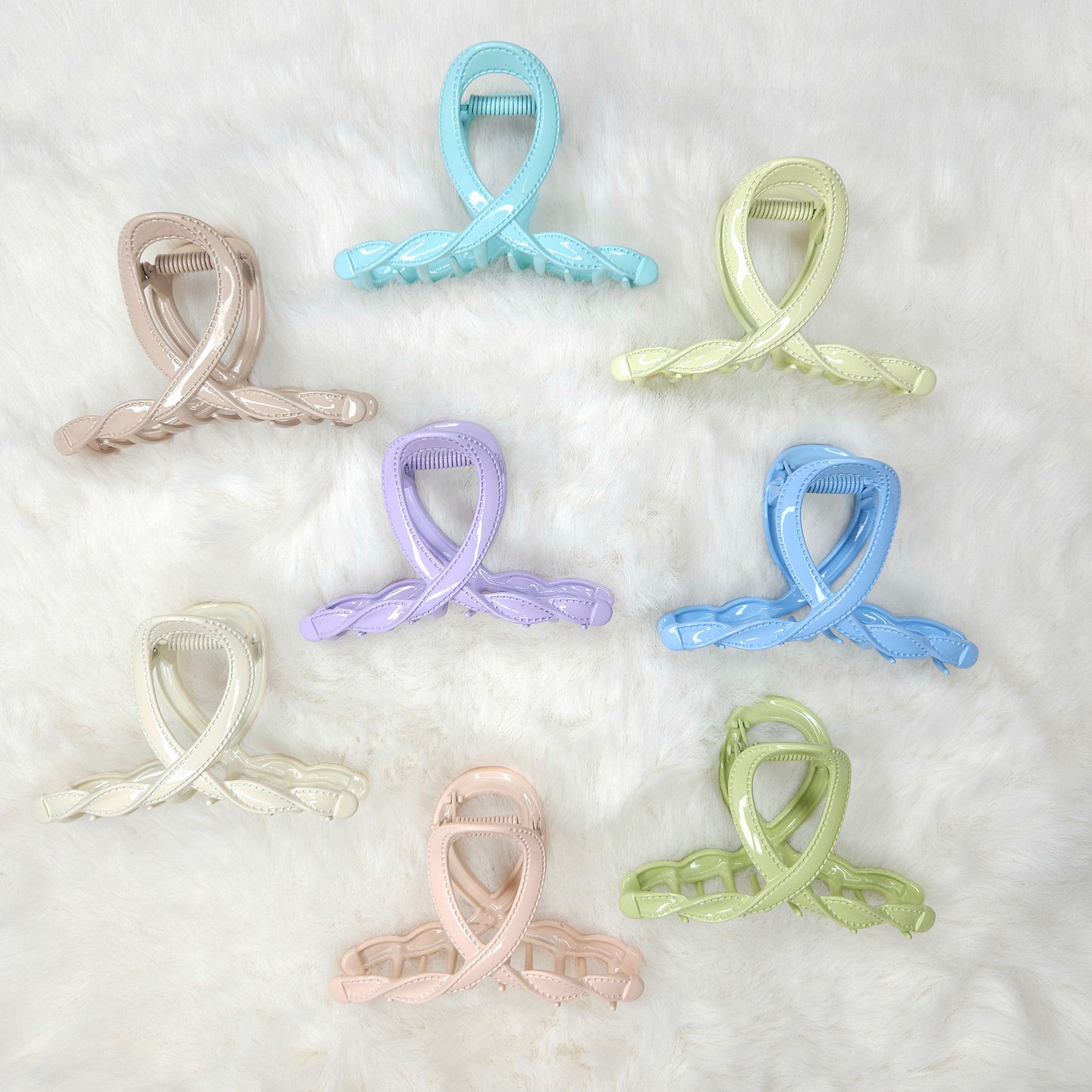 Set of pastel-colored hair clips on a white background