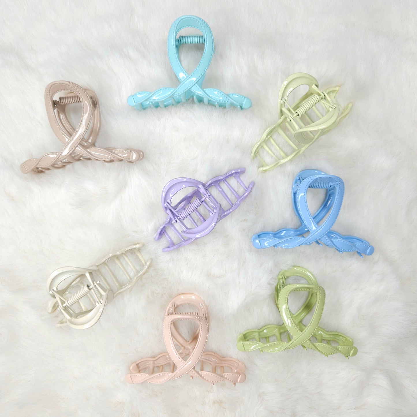 Set of colorful hair clips on a white background