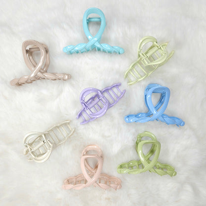 Set of colorful hair clips on a white background